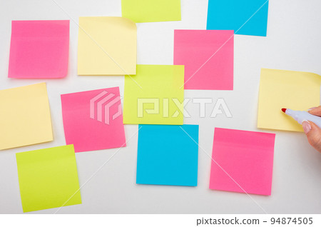 Blank Sticker notes on white background. hand with red marker ready to write. Mockup sticky Note Paper. empty sheets for notes on white bulletin board. Colored sticky notes Blank Sticker notes on white background. hand with red marker ready to write. Mockup sticky Note Paper. empty sheets for notes on white bulletin board. Colored sticky notes 94874505