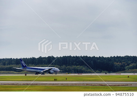 Airport scenery Chitose, Hokkaido, airplane during taxing Airport scenery Chitose, Hokkaido, airplane during taxing 94875510
