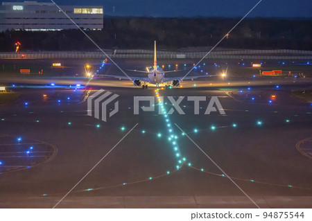 Airport at night Airplane taxiing Chitose City, Hokkaido Airport at night Airplane taxiing Chitose City, Hokkaido 94875544