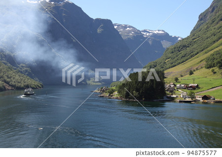 A view of the fjord coastal villages from a cruise ship A view of the fjord coastal villages from a cruise ship 94875577