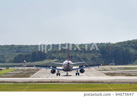 Airport scenery Chitose, Hokkaido, airplane during taxing Airport scenery Chitose, Hokkaido, airplane during taxing 94875647