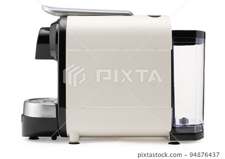 Beige electric coffee machine, for making capsule coffee, on a white background, side view 94876437