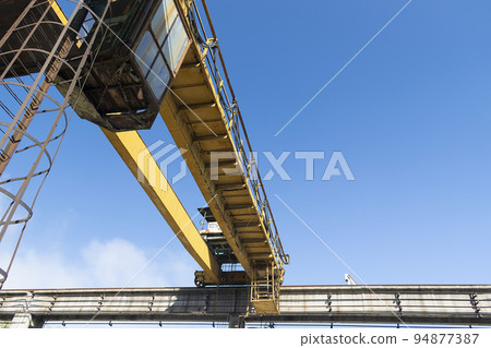 Big yellow lifting crane in the factory Big yellow lifting crane in the factory 94877387