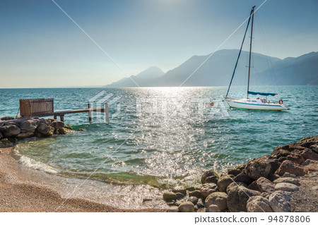 Idyllic lake Garda coastline in Malcesine with sailboats, Northern Italy 94878806
