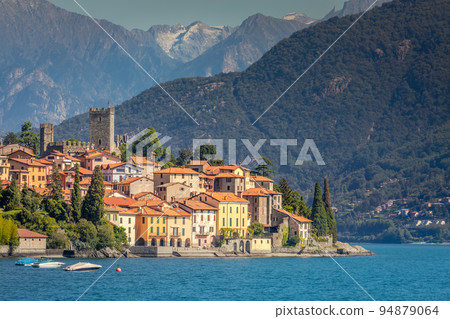 Idyllic Lake Como coastline with village and speedboat at sunny day, Italy Idyllic Lake Como coastline with village and speedboat at sunny day, Italy 94879064