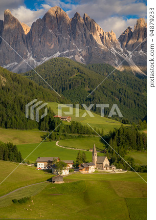 St. Magdalena with famous church in Val di Funes at sunset, Dolomites , Italy 94879233