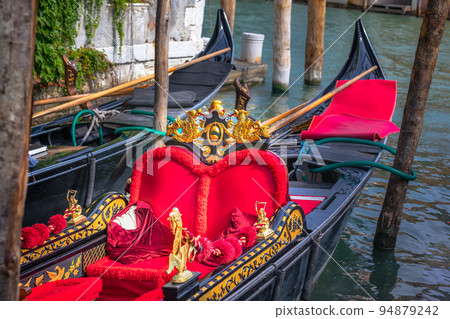 Ornate Gondolas in Grand Canal pier at sunny day, Venice, Italy 94879242
