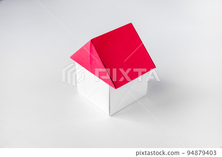 White and red paper house origami isolated on blank background White and red paper house origami isolated on blank background 94879403