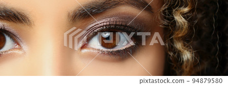 Latino american beautiful woman with brown eyes, curly hairstyle posing for picture Latino american beautiful woman with brown eyes, curly hairstyle posing for picture 94879580