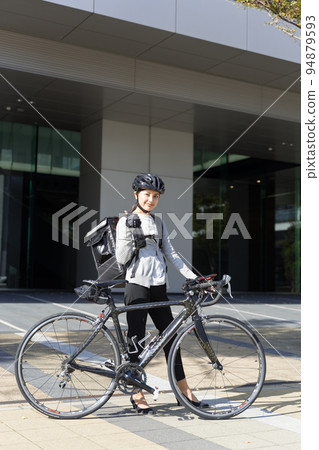 Food delivery with a thumbs up Female delivery worker Food delivery with a thumbs up Female delivery worker 94879593