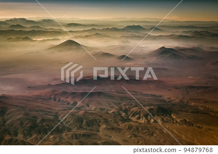 Aerial Atacama desert, snowcapped volcanoes and arid landscape in Chile 94879768