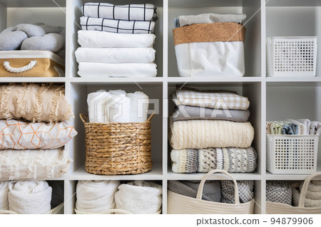 Bed linens closet neatly arrangement on shelves with copy space domestic textile Nordic minimalism 94879906
