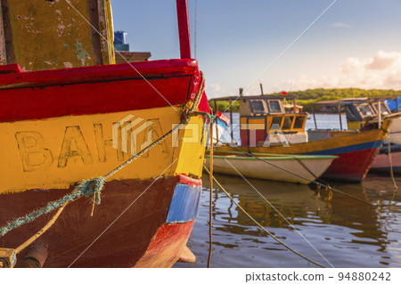 Bay at sunset with fishing trawler rustic boats in Porto Seguro, BAHIA, Brazil Bay at sunset with fishing trawler rustic boats in Porto Seguro, BAHIA, Brazil 94880242