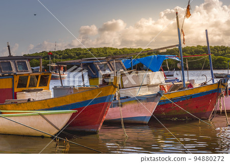 Bay at sunset with fishing trawler rustic boats in Porto Seguro, BAHIA, Brazil 94880272