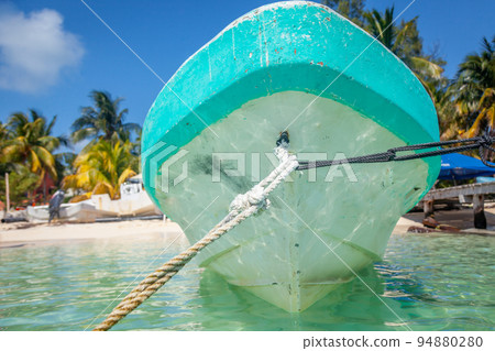 Cancun marina with rustic boat, caribbean beach at sunset, Riviera Maya, Mexico Cancun marina with rustic boat, caribbean beach at sunset, Riviera Maya, Mexico 94880280
