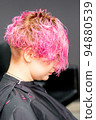 Beautiful young pink haired caucasian woman in the modern hair salon 94880539