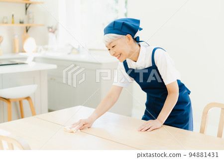 Housekeeper senior woman wiping Housekeeper senior woman wiping 94881431