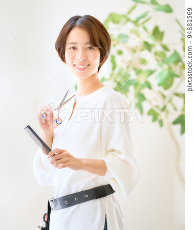 Image of hair stylist woman looking at hair salon hairdresser 94881569