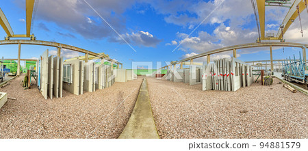 Panoramic view over an element stock in a precast concrete plant Panoramic view over an element stock in a precast concrete plant 94881579
