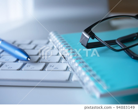 Business image of notebooks, glasses, and personal computers Business image of notebooks, glasses, and personal computers 94883149