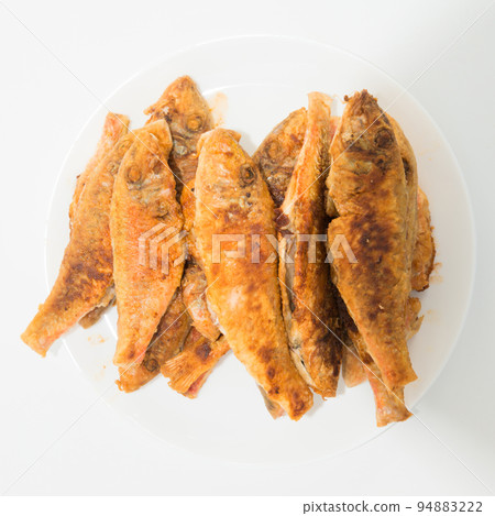 Dish of fried fishes red mullets 94883222
