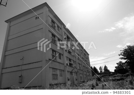 A ruined residential complex 94883301