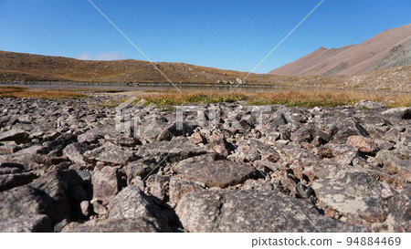 Natural paving stones made of stones in mountains 94884469