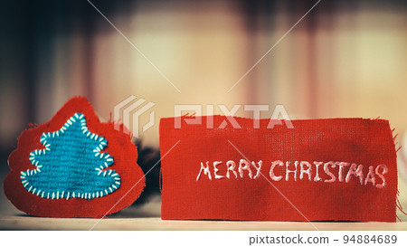festive background. Christmas tree figurine and the words merry festive background. Christmas tree figurine and the words merry 94884689