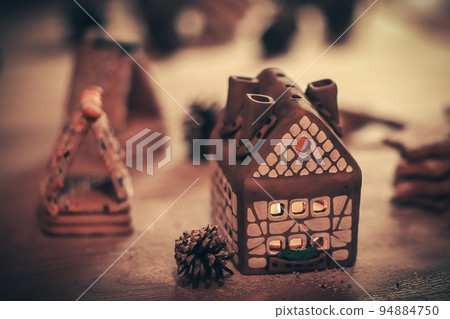 gingerbread house in the background of the Christmas table gingerbread house in the background of the Christmas table 94884750