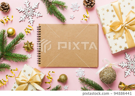 Christmas blank greeting card mock-up scene. Creative layout made of Christmas tree branches and paper card note. Flat lay. Nature New Year concept Christmas blank greeting card mock-up scene. Creative layout made of Christmas tree branches and paper card note. Flat lay. Nature New Year concept 94886441