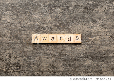 AWARDS word written on wood block. AWARDS text on cement table for your desing, concept AWARDS word written on wood block. AWARDS text on cement table for your desing, concept 94886734