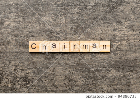 CHAIRMAN word written on wood block. CHAIRMAN text on cement table for your desing, concept CHAIRMAN word written on wood block. CHAIRMAN text on cement table for your desing, concept 94886735