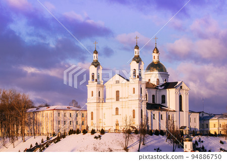 Vitebsk, Belarus. Morning View Of Famous Landmark Is Assumption Cathedral Church In Upper Town On Uspensky Mount Hill In Sunrise Illumination. Soft Colors. Cathedral On Background Toned Cloudy Sky Vitebsk, Belarus. Morning View Of Famous Landmark Is Assumption Cathedral Church In Upper Town On Uspensky Mount Hill In Sunrise Illumination. Soft Colors. Cathedral On Background Toned Cloudy Sky 94886750