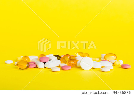 Many different colorful medication and pills perspective view. Set of many pills on colored background Many different colorful medication and pills perspective view. Set of many pills on colored background 94886876