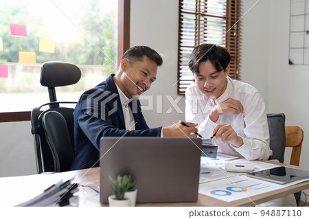 Financial advisory concept. Asian advisor showing plan of investment to clients in the consultancy office. 94887110