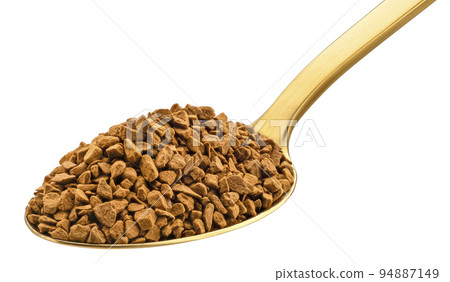 Instant coffee in gold spoon isolated on white background 94887149