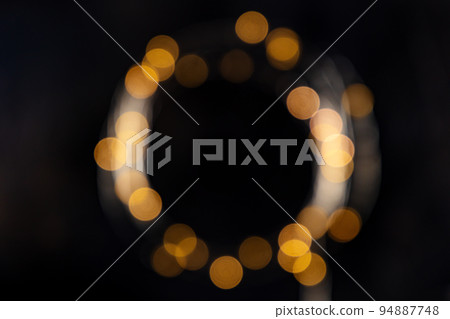 Fairy lights, blurred frame on a black background, abstract Christmas banner Fairy lights, blurred frame on a black background, abstract Christmas banner 94887748