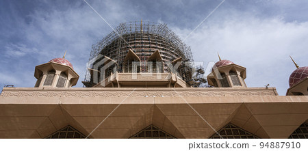 Malaysia, July 10, 2022 - Putra Mosque with dome under renovation Malaysia, July 10, 2022 - Putra Mosque with dome under renovation 94887910