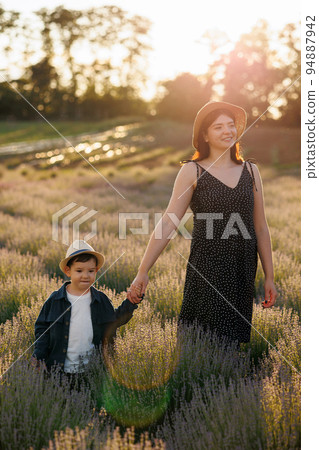 Happy family in lavender field Happy family in lavender field 94887942