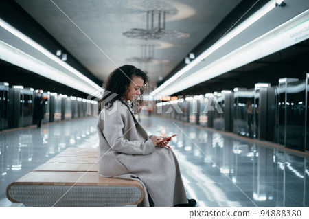 young woman reading an email on her smartphone. young woman reading an email on her smartphone. 94888380