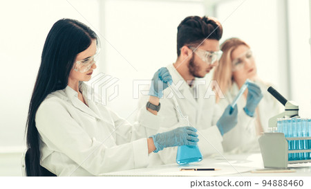 close up.modern woman sitting with colleagues at the laboratory 94888460