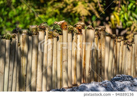 original burning Khao Lam glutinous sticky rice in coconut roasted in bamboo joints or Khao Lam food in Thai land is Thai dessert. original burning Khao Lam glutinous sticky rice in coconut roasted in bamboo joints or Khao Lam food in Thai land is Thai dessert. 94889136