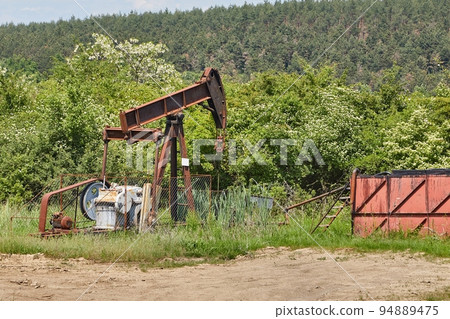 Oil well on a landscape 94889475