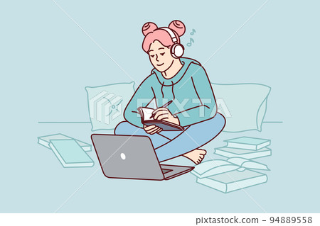 Girl in headphones study on laptop at home  94889558