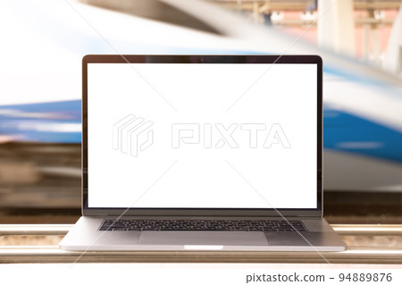 Laptop with white screen in railway station. Empty copy space, blank screen mockup. Soft focus Laptop with white screen in railway station. Empty copy space, blank screen mockup. Soft focus 94889876