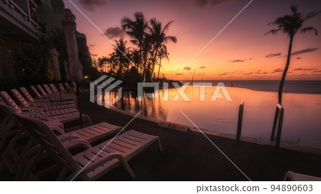 Okinawa moon beach hotel poolside sunset 94890603