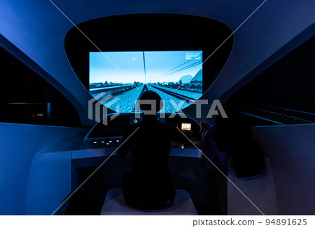 Schaerbeek, Brussels Capital Region - Belgium - Young woman driving a train in a trainsimulator at Trainworld 94891625