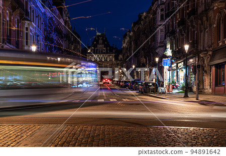 Saint- Gilles, Brussels Capital Region - Belgium -Tramway passing by at the Barriere roundabout by night Saint- Gilles, Brussels Capital Region - Belgium -Tramway passing by at the Barriere roundabout by night 94891642