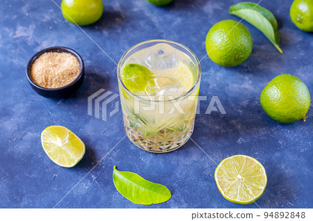 Caipirinha is famous Brazilian cocktail made with rum, lime and cane sugar Caipirinha is famous Brazilian cocktail made with rum, lime and cane sugar 94892848