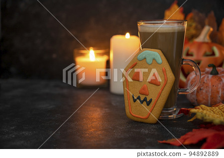 Halloween cookie with candles. Spooky ginger bread cookies dark moody background Halloween cookie with candles. Spooky ginger bread cookies dark moody background 94892889
